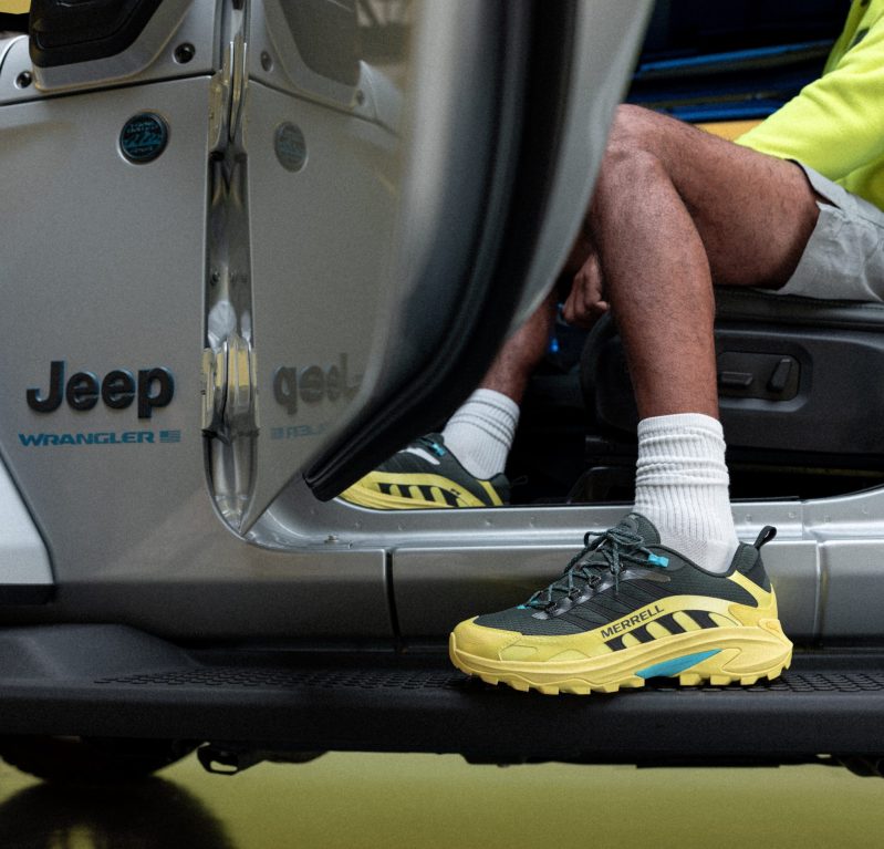 person entering Jeep wearing bold hiking boot