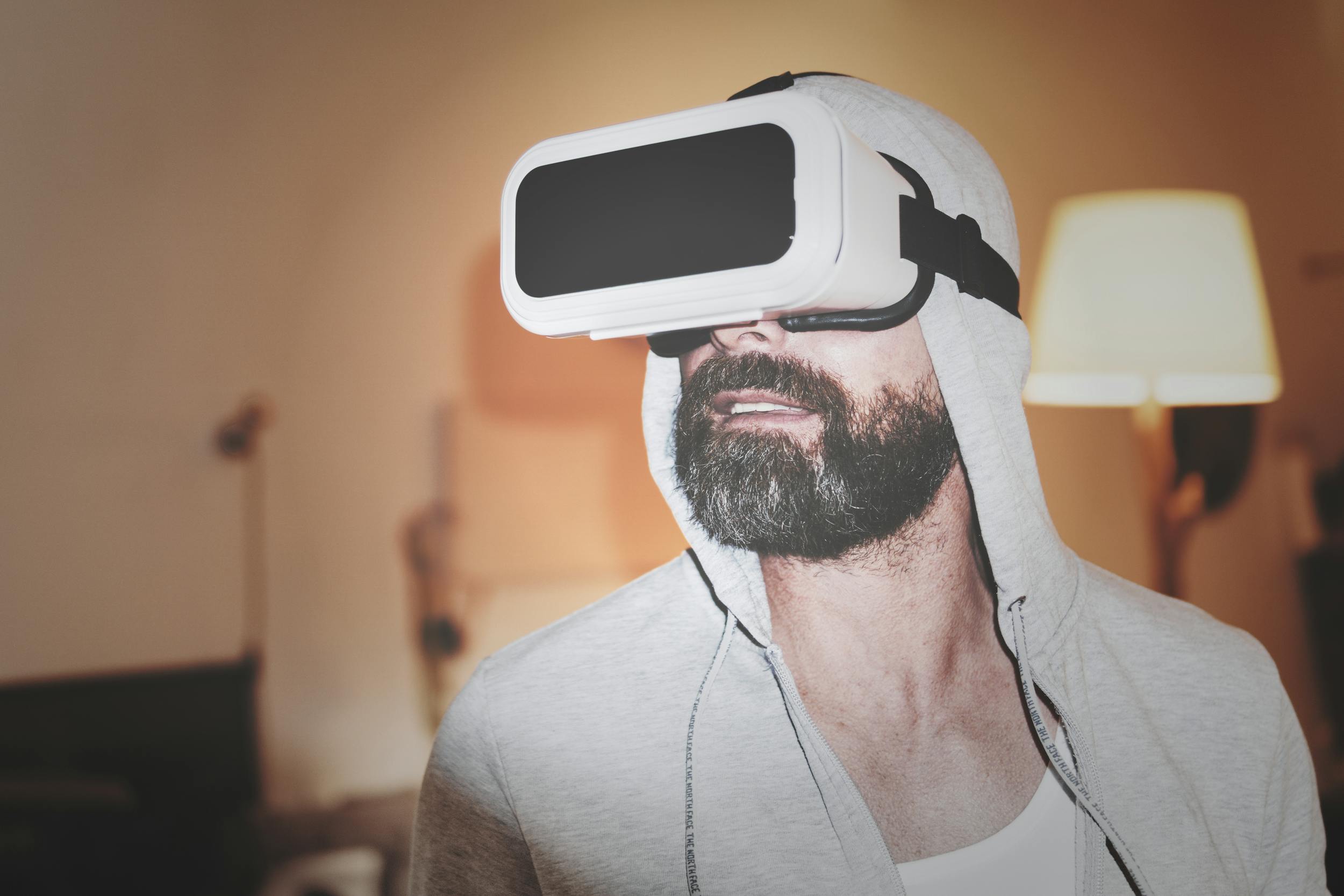 man wearing virtual reality headset and hoodie vr